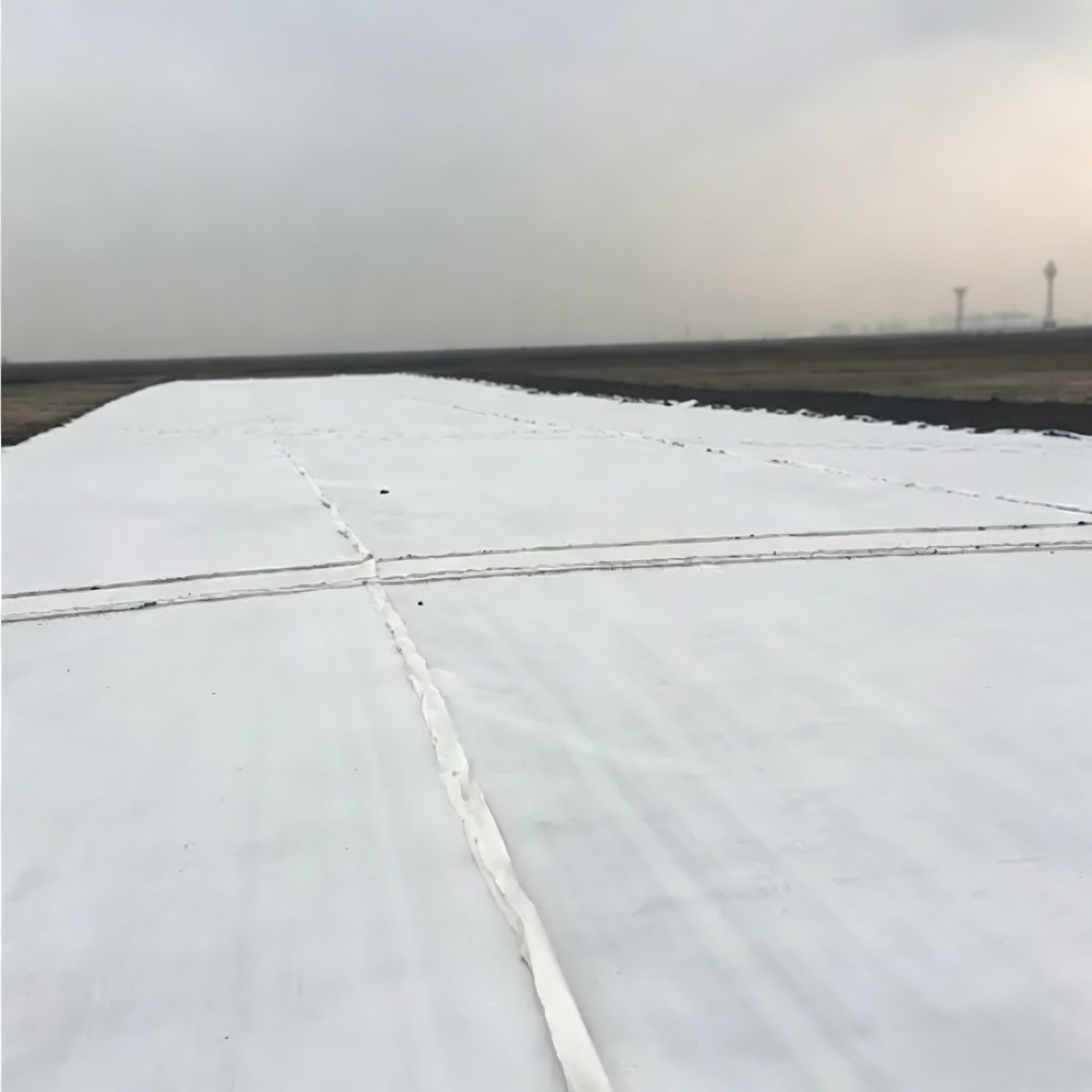 Geotextil no tejido punzonado con aguja de fibra larga continua 100% Polyester para filtración de arena, refuerzo de pavimentos