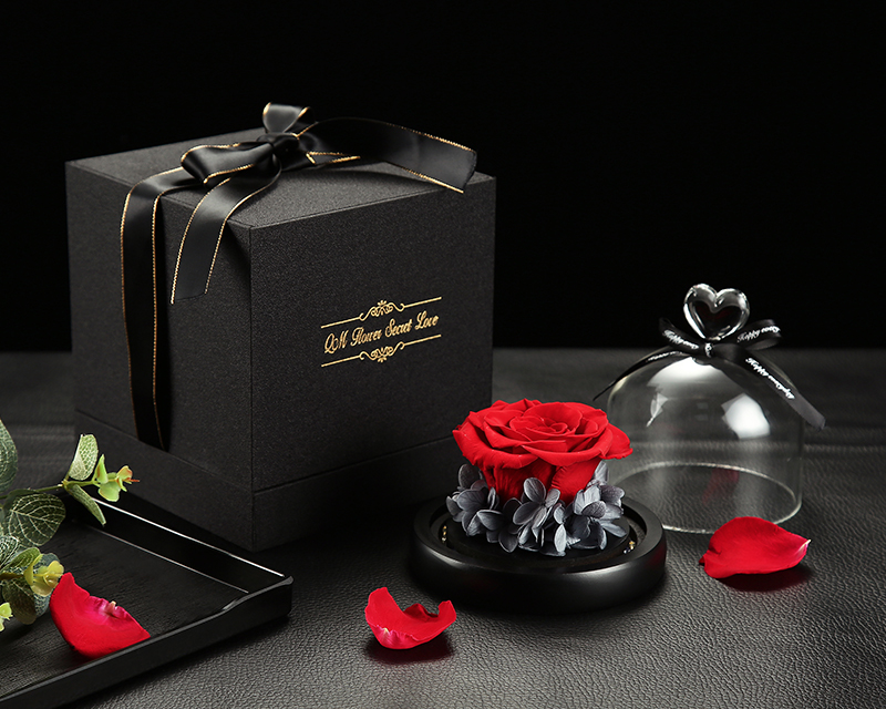 Preserved rose in glass cover