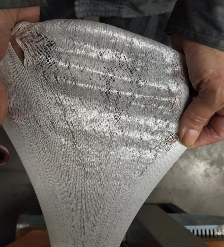 Weft free tape with mesh