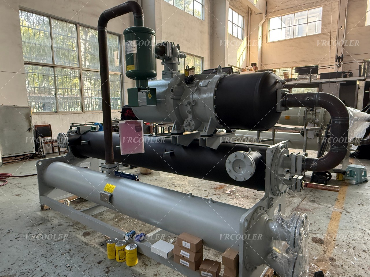 What is a flooded shell and tube evaporator?