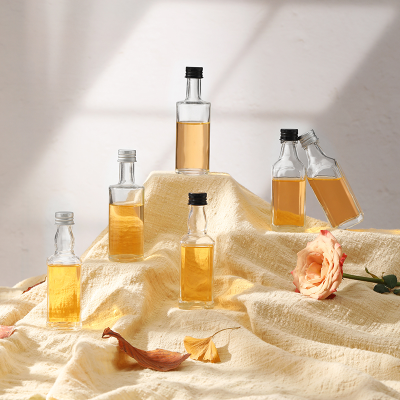 Mini botellas de licor de vidrio personalizadas transparentes