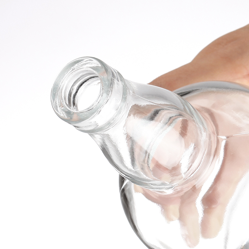 Botella de whisky vacía de vidrio de 750 ml.