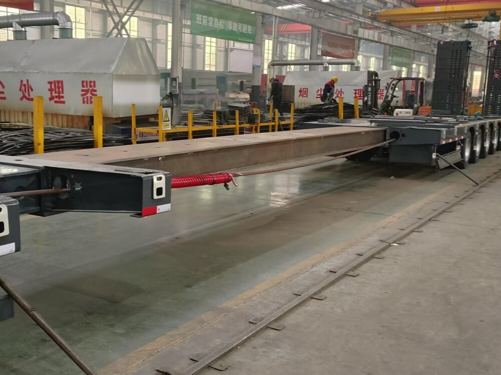 Semirremolque de plataforma baja extensible de 6 ejes con ejes de dirección