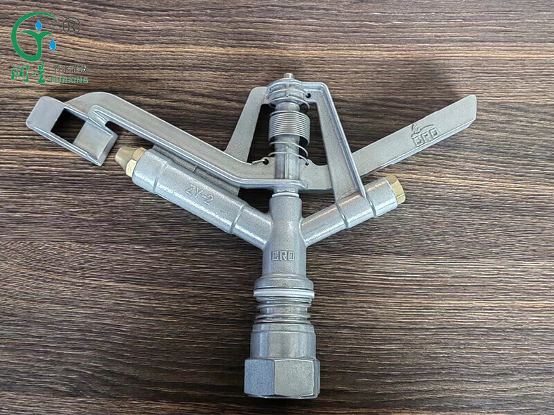 Aspersor de brazo basculante