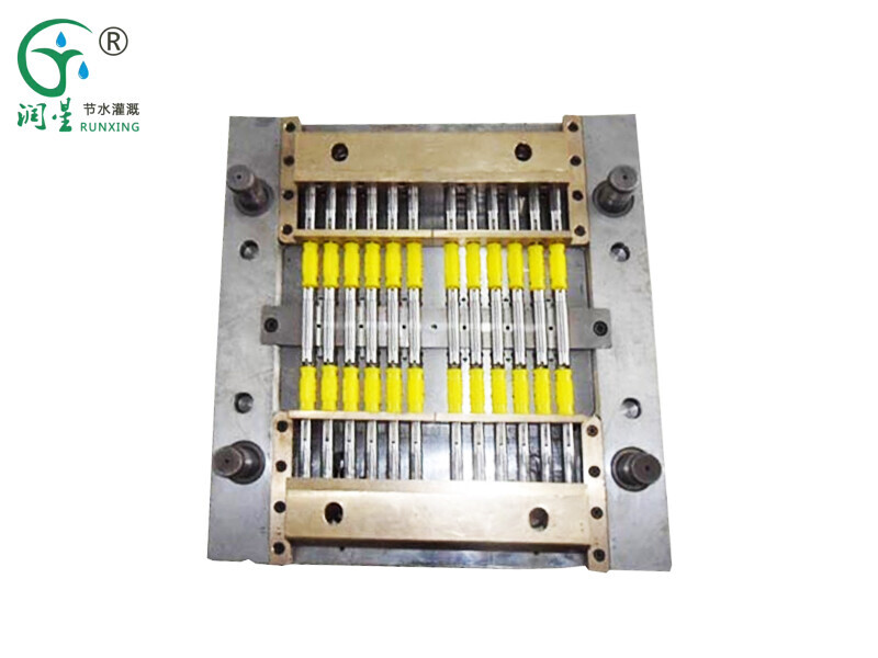 Molde de gotero cilíndrico con incrustaciones