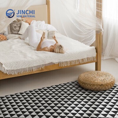 PVC rug with geometric triangle pattern