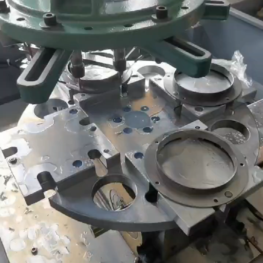 Application of waterproof four-station cam divider in automatic tapping machine industry