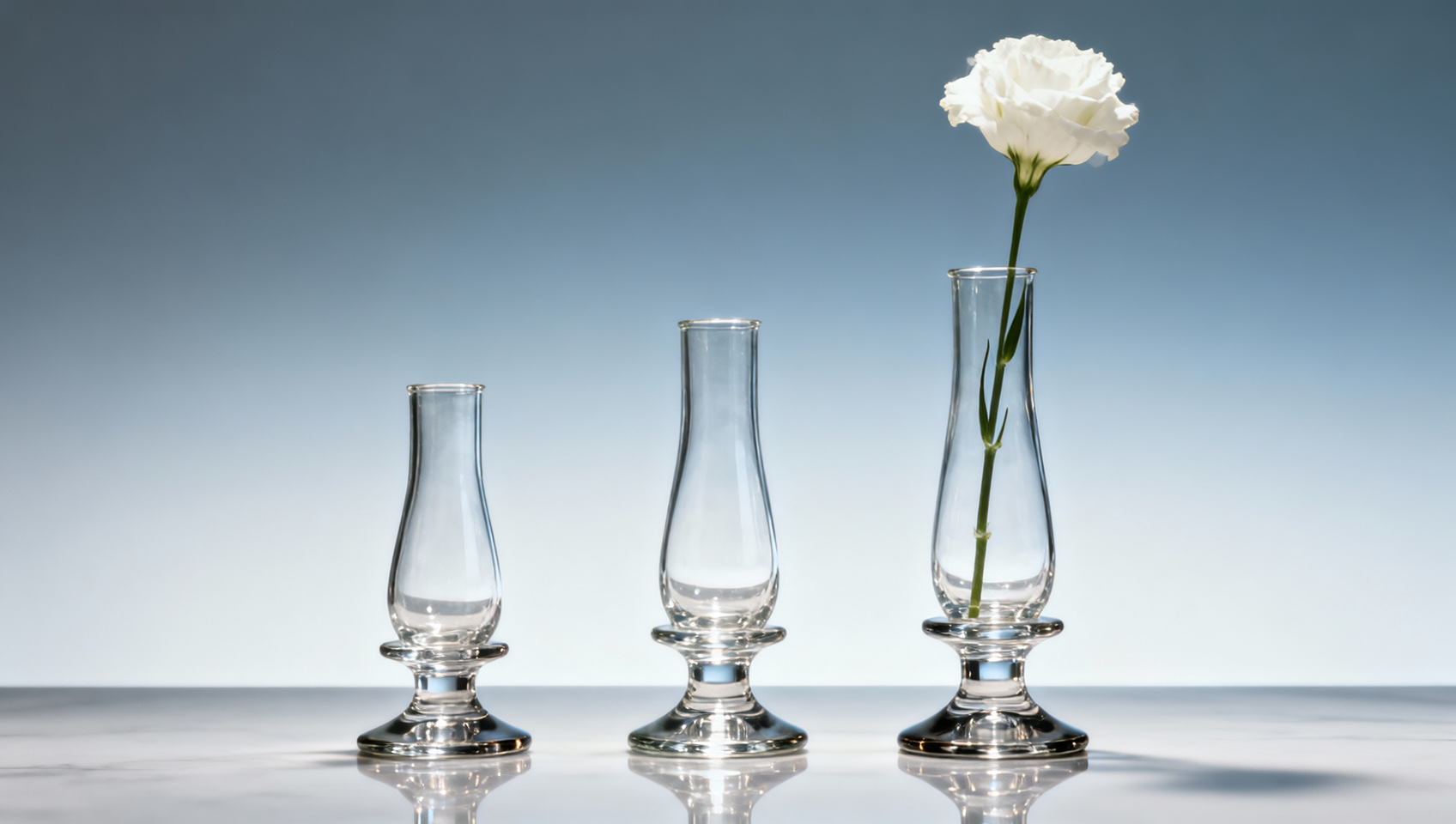 Glass bud vases tip over easily — center of gravity vs. base width trade-off