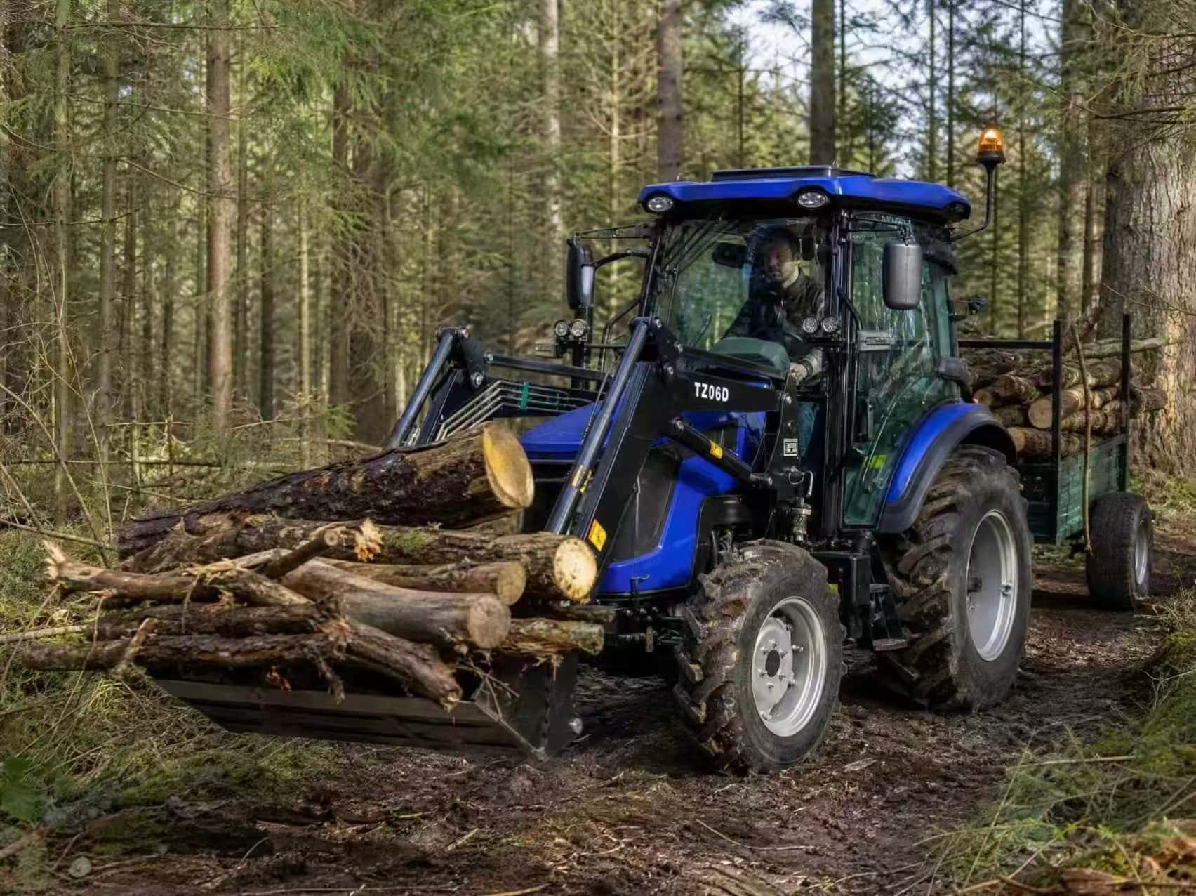 Tractor OXPLO con cucharón 4 en 1: aplicaciones para carga, limpieza y nivelación en explotaciones agrícolas Tractor OXPLO con cucharón 4 en 1: aplicaciones para carga, limpieza y nivelación en explotaciones agrícolas