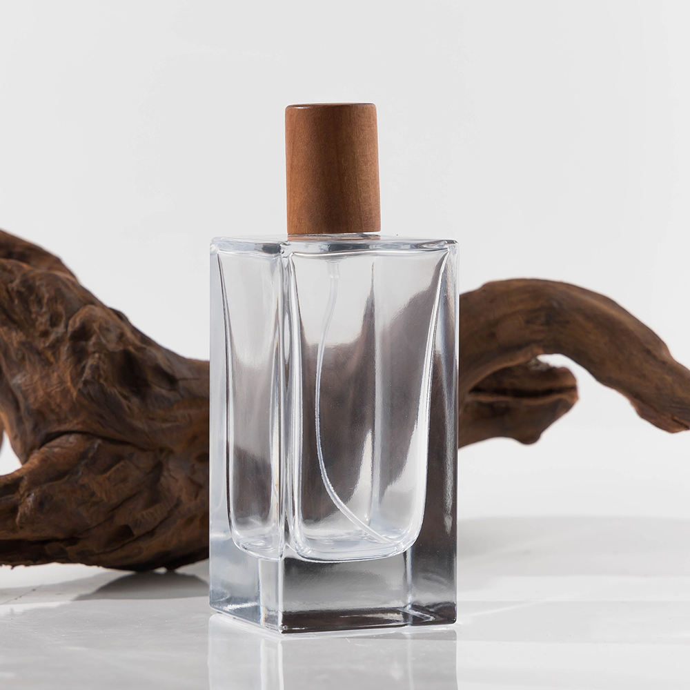 Fabricante de botellas de perfume de lujo de alta calidad, 50 ml y 100 ml, botellas de vidrio vacías recargables con pulverizador, hermosas botellas de perfume